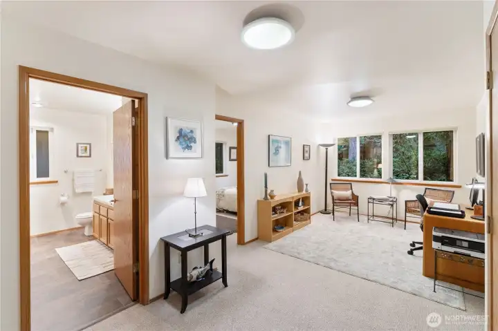 Entering the lower level, Laundry and full bath, den/office area and 2 bedrooms.