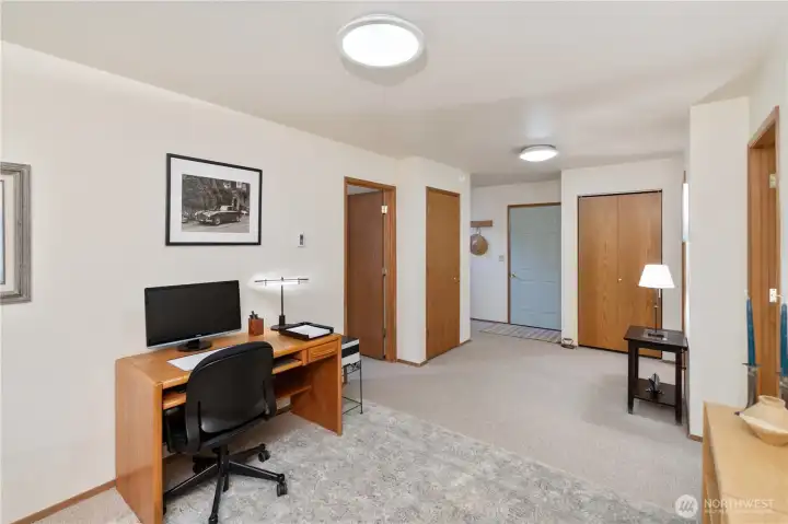 Several cabinets for great storage and the door to the garage.