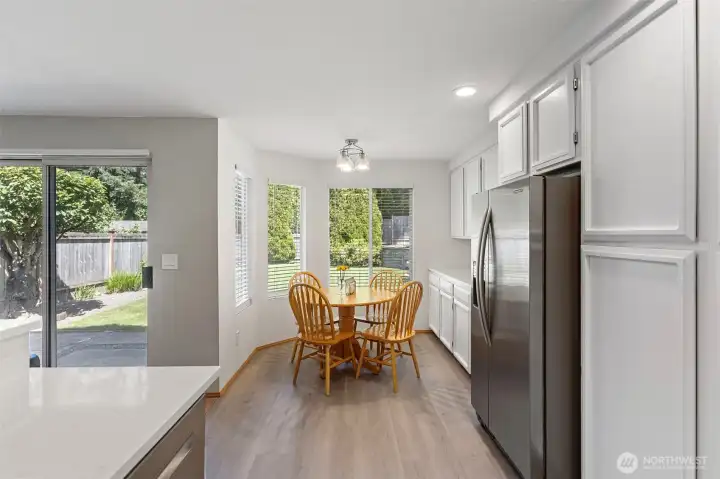 Eating area off the kitchen with more cabinets