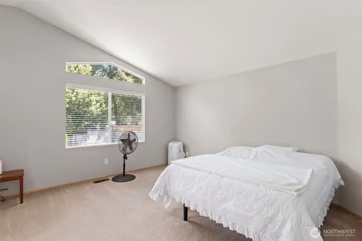 Large primary bedroom with ensuite bath and walk in closet