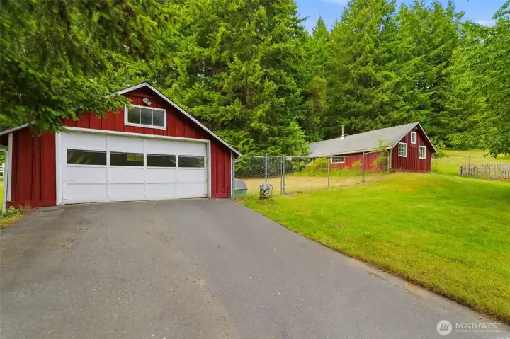 800 SF garage with dog kennel space between another approx. 800 SF shop/studio space. 800 SF garage with dog kennel space between another approx. 800 SF shop/studio space.