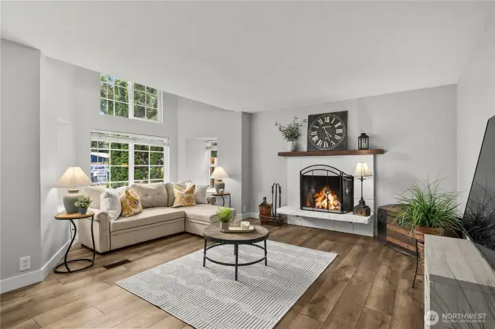Spacious light filled family room with cozy wood-burning fireplace. Spacious light filled family room with cozy wood-burning fireplace.