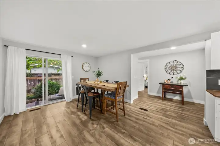 Large dining area with beautiful Hardwood-style laminate flooring throughout the home. Large dining area with beautiful Hardwood-style laminate flooring throughout the home.
