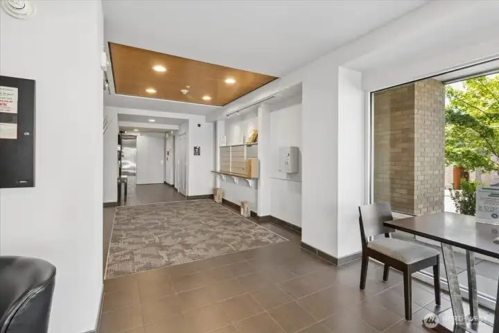 Front entrance, mailboxes and elevator.