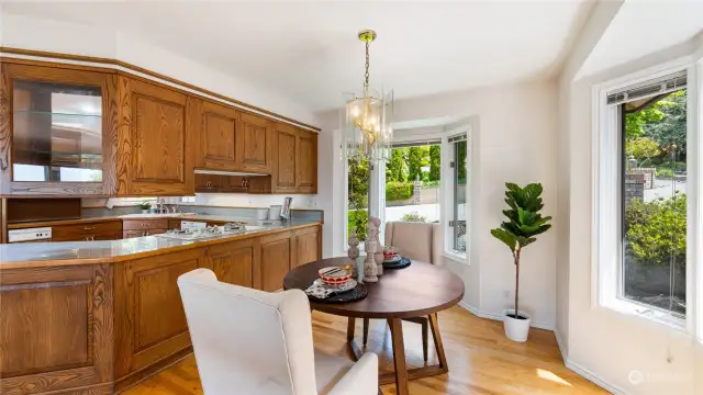 Delightful breakfast nook enjoys bright light and views of the landscaping.