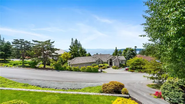 Absorb the unobstructed views out to the water, overlooking the beautifully landscaped yard.