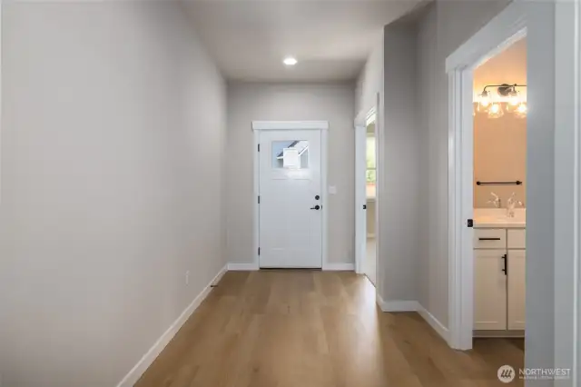 LVP flooring in the entry, great room, kitchen and dining room.