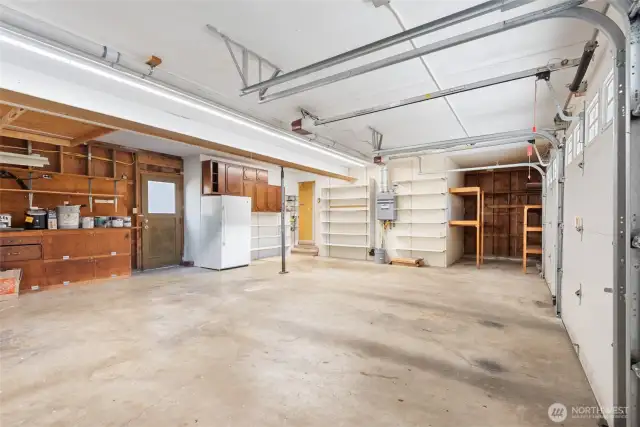 Large three car garage with extra storage (not shown).
