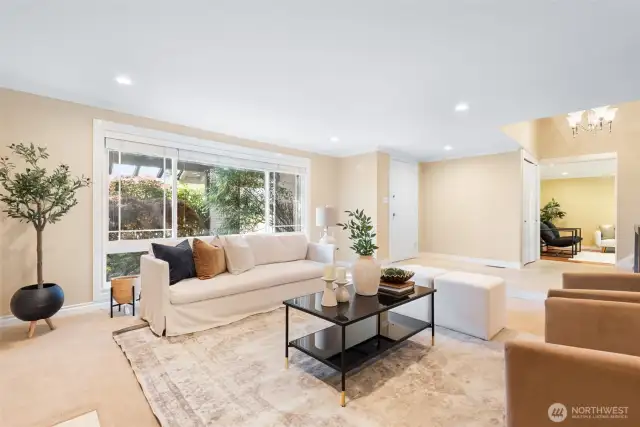 View of the lounge area with front door in back ground