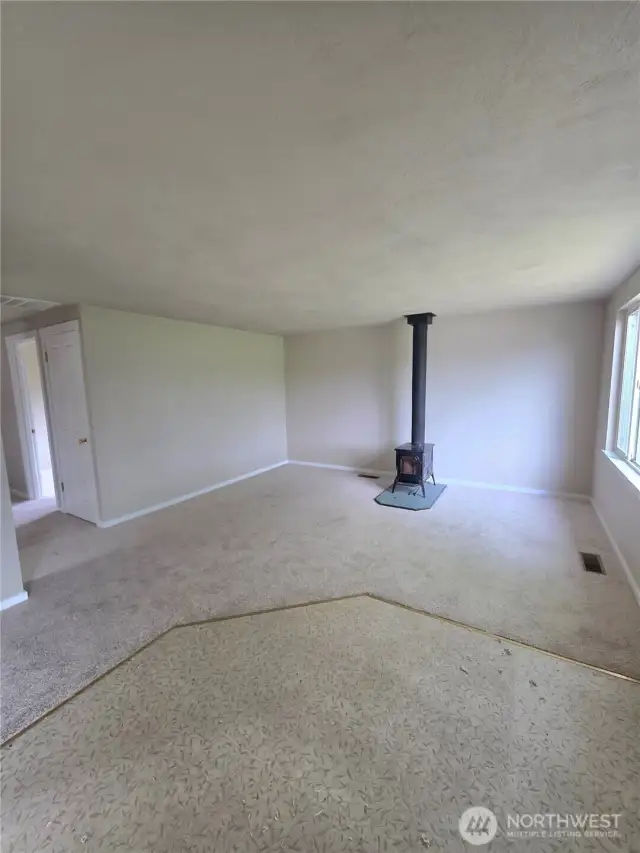 Living room w/ wood burning stove