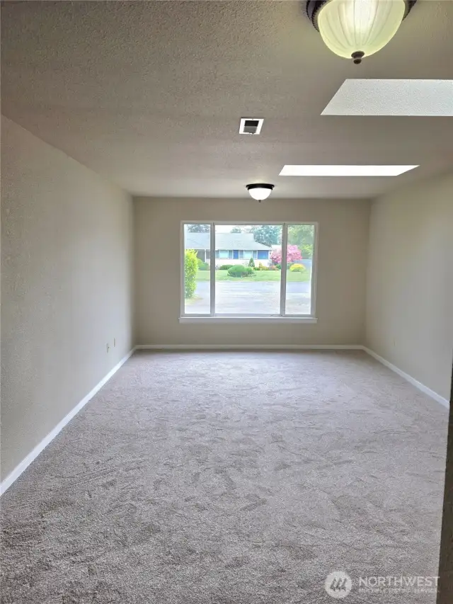 Other view of family room w/ skylights