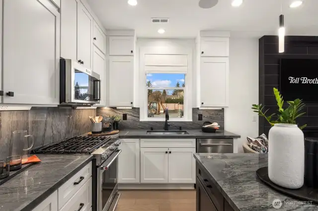 Photos are of a previous model of similar floorplan. Details, surfaces and features may differ. For demonstration purposes only.
