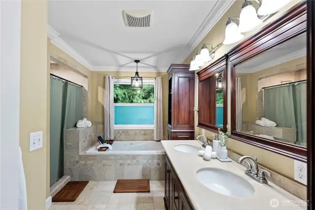 Primary bathroom with oversized shower, soaking tub, and double vanity.