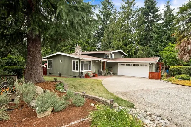 You'll love this updated 4 bedroom tri-level on it's large serene lot!