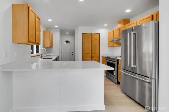 Quartz counters. Room for bar stools here.