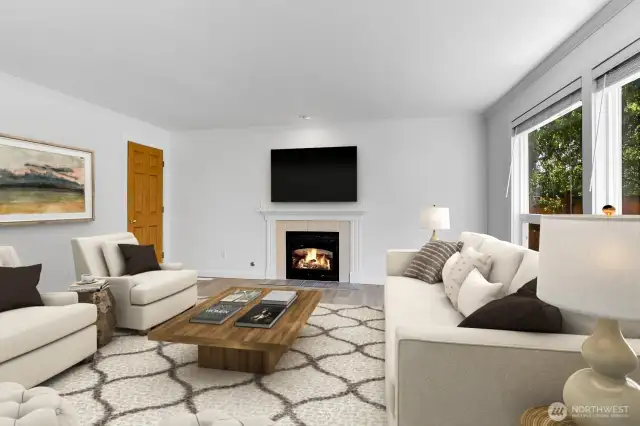 Living room, with gas fireplace. The door on the left is perfect for gaming.