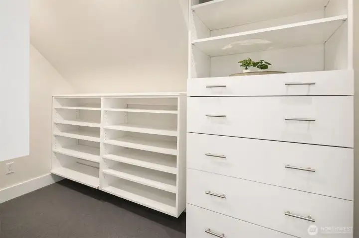 1 of 2 walk-in closets in the primary. All fully built out.