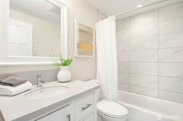 DADU- Full bathroom with heated floors and towel warmer.