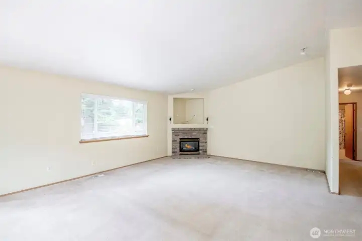 Oversized living rom with gas fireplace.