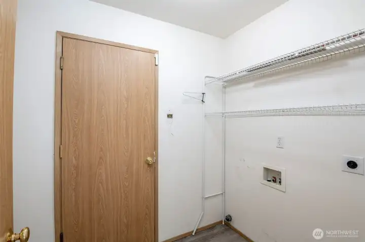 Utility room. Door leads to attached garage.