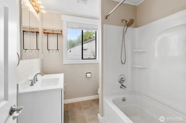 Full bathroom. Has in floor heat, Bluetooth speaker