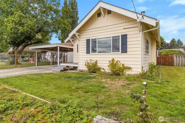 Front yard with some flower beds along the house