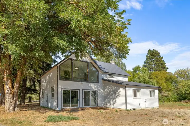 Peaceful country setting with mature trees for privacy.