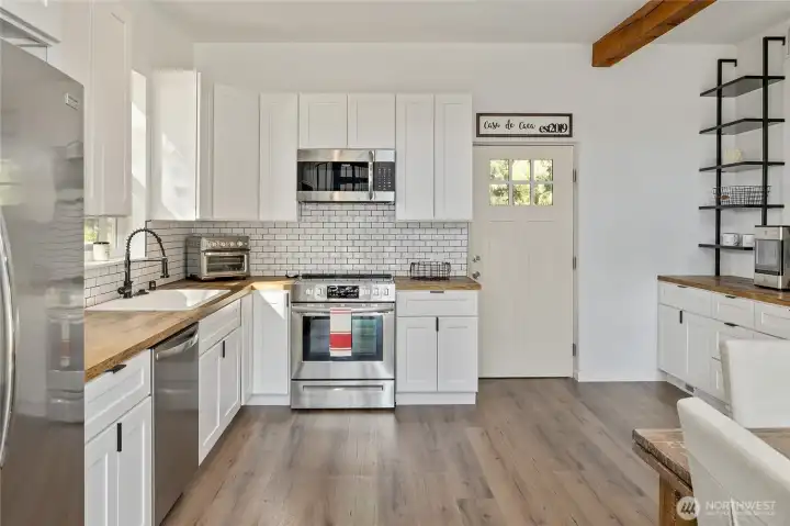 Completely remodeled kitchen with modern finishes.