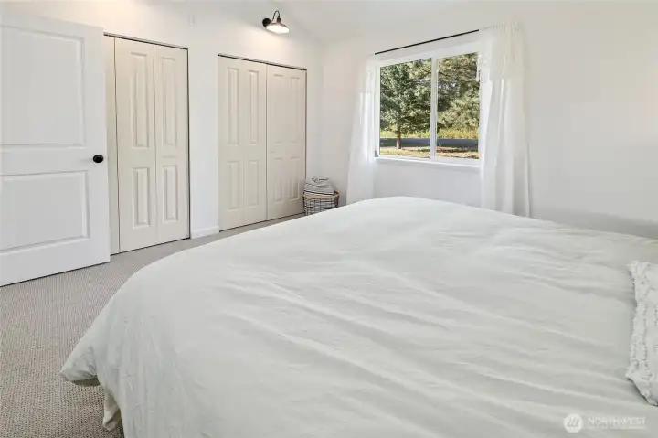 Another view of the main floor bedroom with dual closets.