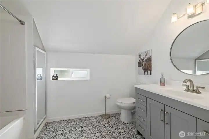 Primary ensuite bath with thoughtful upgrades.