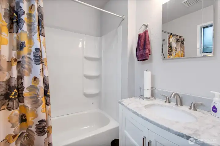 Full bath with tub and shower.