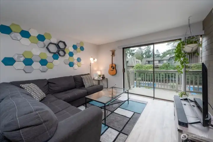 Light and bright living room with slider to deck.