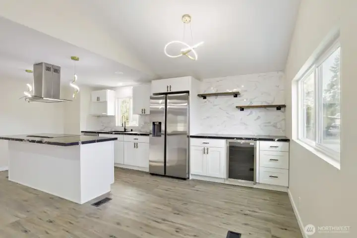Dining area with built-in cabinets, extra counter space & beverage fridge