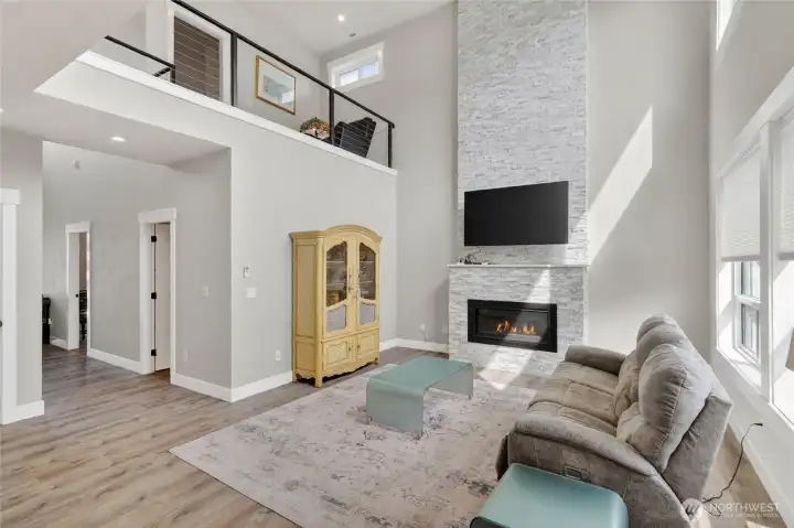 Off the entry hall you'll find the living room with vaulted ceiling, the center of this home.