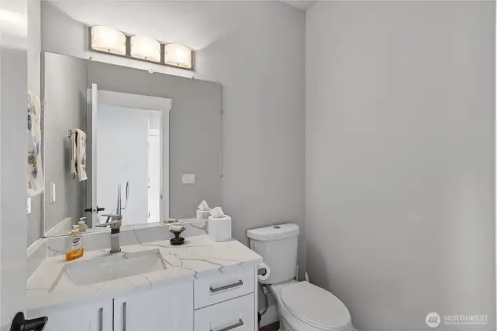 Main floor powder room is off the entry hall.