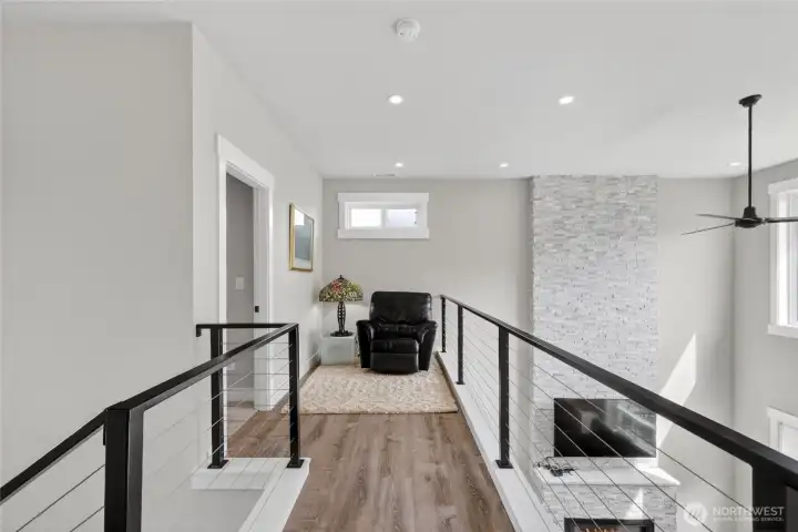 Upstairs is a seating area open to the living room for lots of light.
