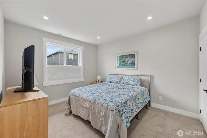 Second bedroom upstairs has lots of space.