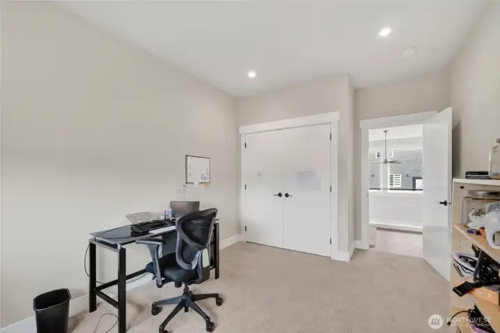 Another view of third upstairs bedroom, showing closet and hall door.