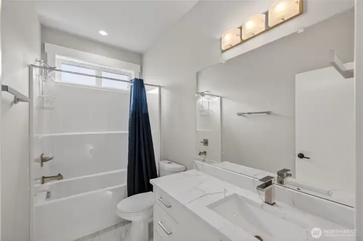 Full bathroom upstairs serves bedrooms 2 and 3.