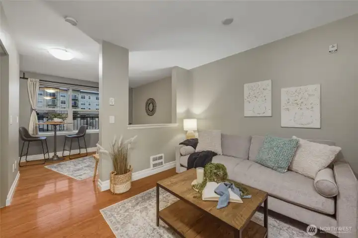 Step inside and instantly feel at home. The entry opens to warm bamboo floors, soft neutral tones, and a floor plan that maximizes comfort and privacy.