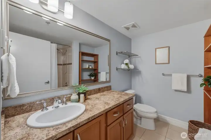 A good sized full bathroom with a tub and shower.
