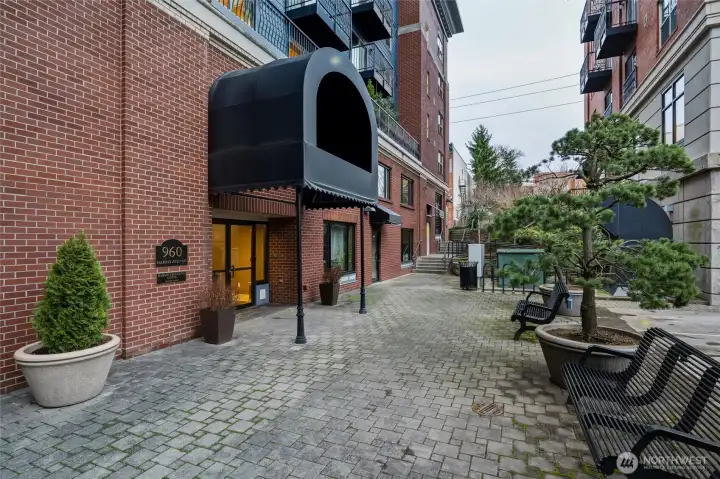 A court yard located outside the compelx providing guest parking and areas to enjoy the outdoors with stairways leading to the town.