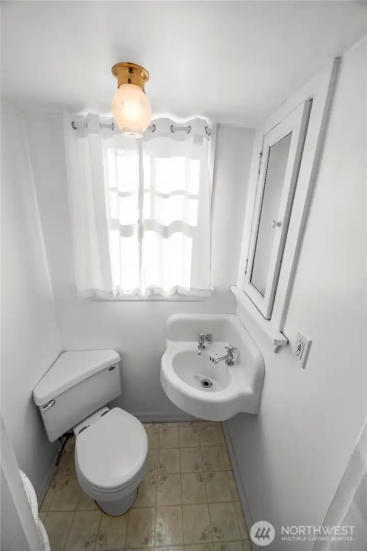 What a sweet little half bath.