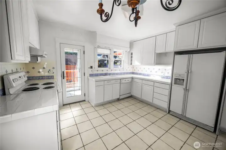 Will you keep the kitchen in its current form or will you get creative and create a masterpiece?  Single door leads to mud room which then leads to back deck and yard.