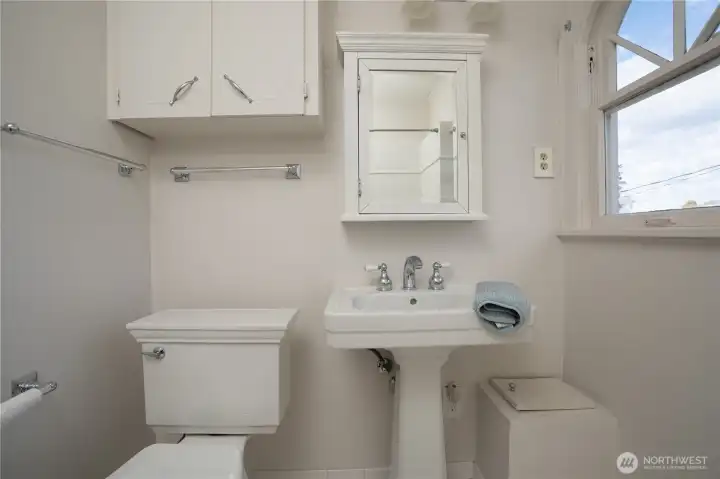 A full bath is located centrally between the 4 bedrooms and it has a fun laundry shoot.