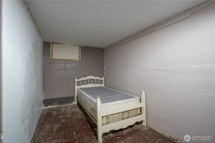 No, this isn't a bedroom (no immediate/easy egress nor does it have a closet,) but it is yet another area to finish or, you got it, great storage.