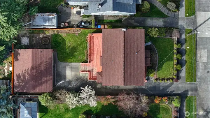 An aerial shot shows the fun landscaping and placement of the home on its lot.  And?  The roofs still have lots of life left, having been replaced approximately 10 years ago.