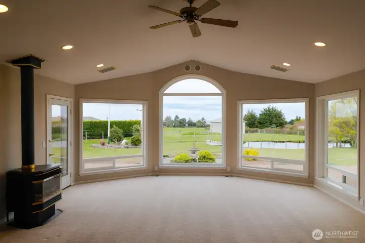 Expansive Living Room with gas fireplace and views to the water