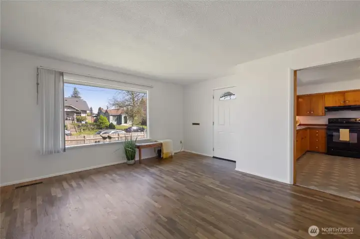 large picture window looks to front yard.