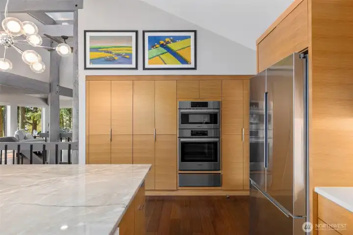 Not your everyday kitchen! Custom rift sawn white oak cabinetry throughout kitchen frames gleaming Bosch appliances- Over and Above! Not your everyday kitchen! Custom rift sawn white oak cabinetry throughout kitchen frames gleaming Bosch appliances- Over and Above!